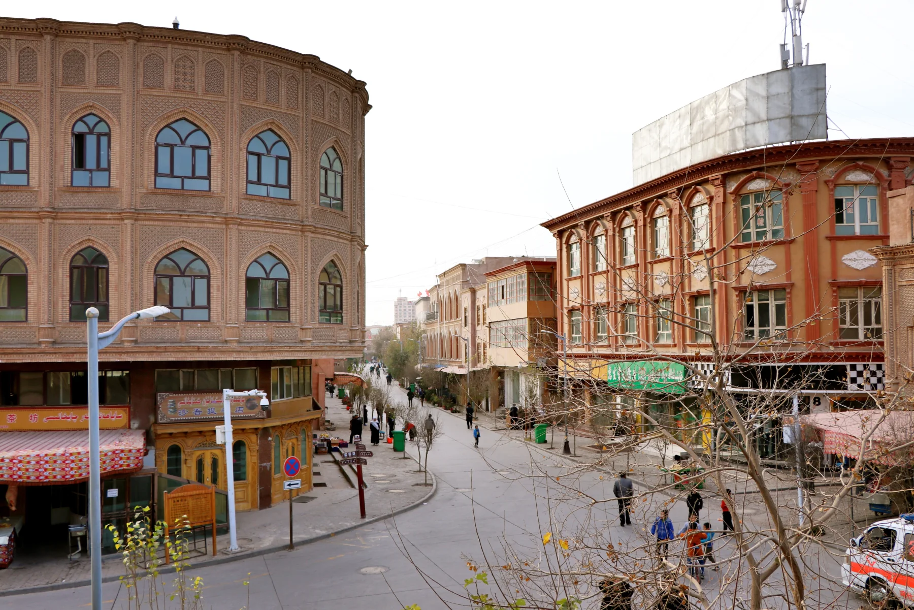 A contemporary Kashgar street where brick facades, shops, homes and urban services meet