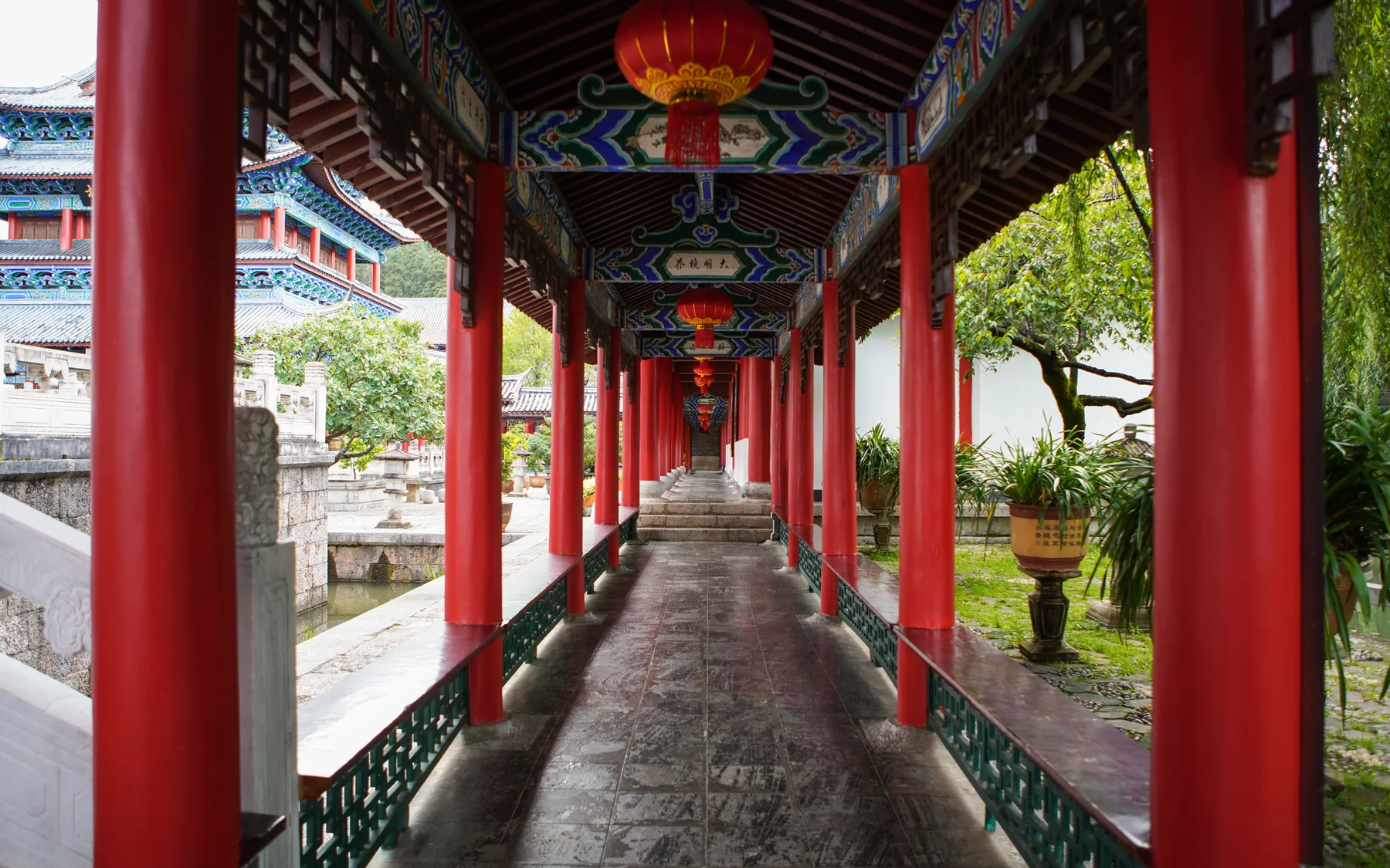A timber corridor inside Mufu showing stairs, thresholds and the walking surfaces travelers actually cross