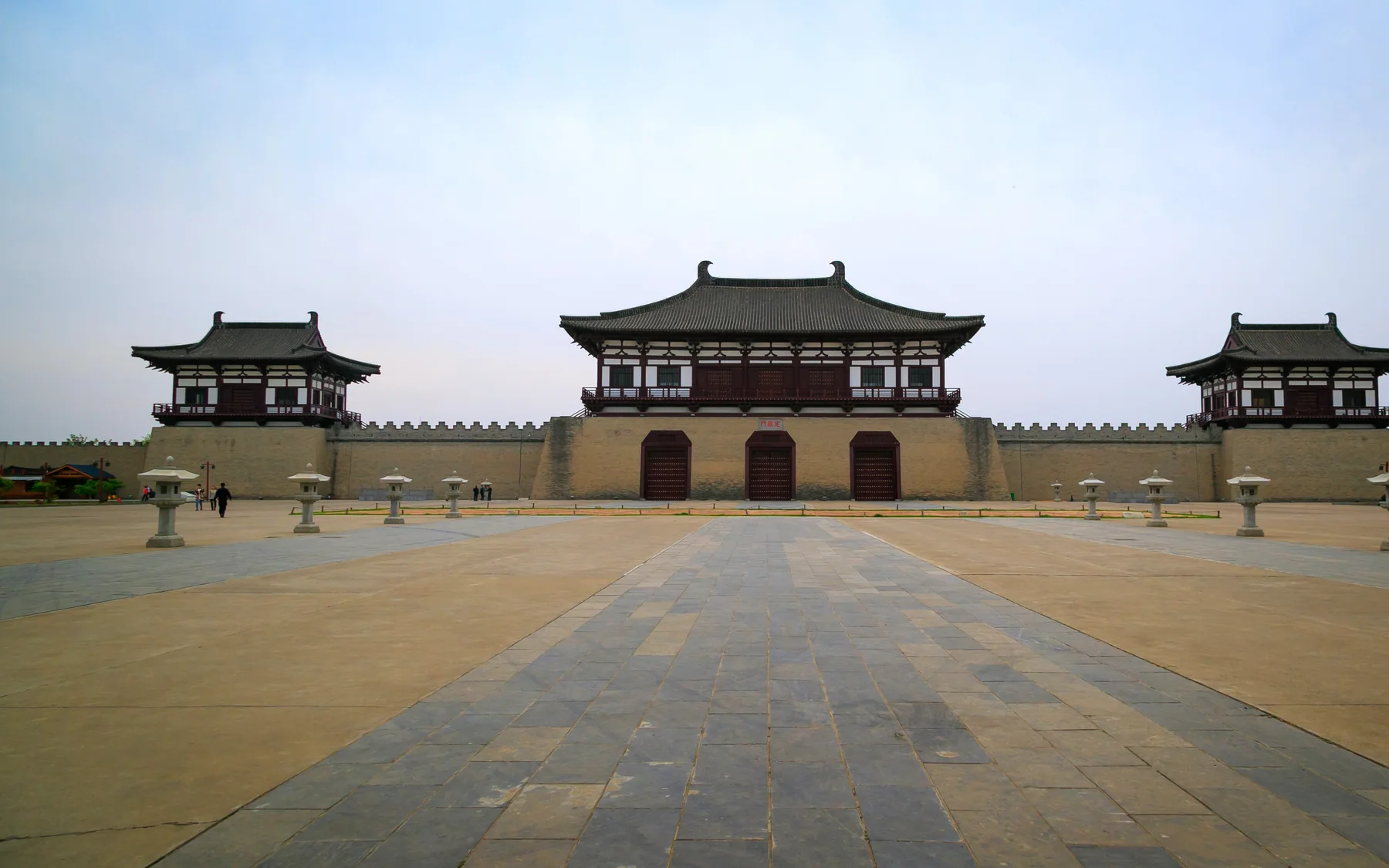 Dingding Gate in daylight showing the scale of its reconstructed urban-axis presentation