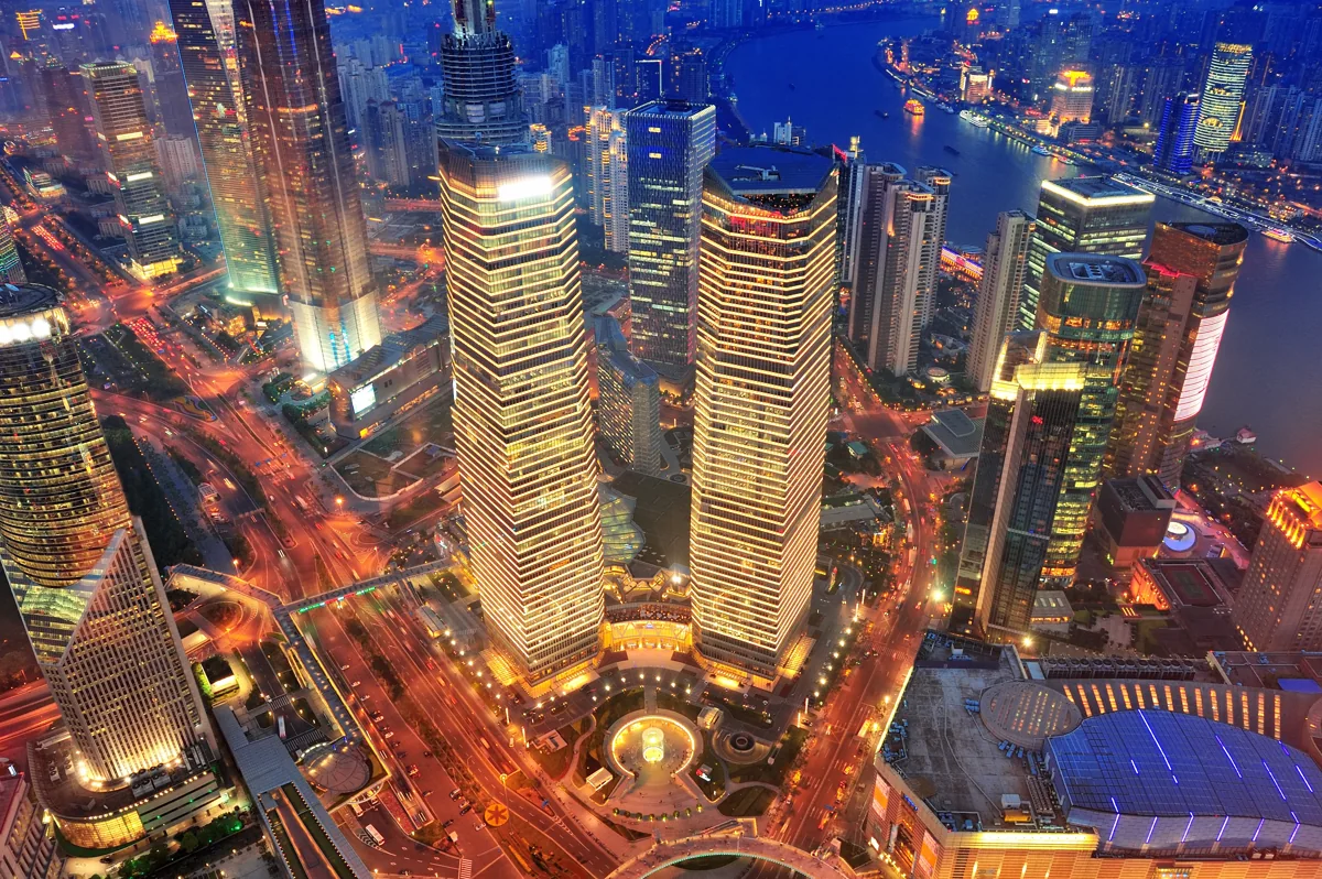 Shanghai towers, river and dense city lights during travel to Shanghai