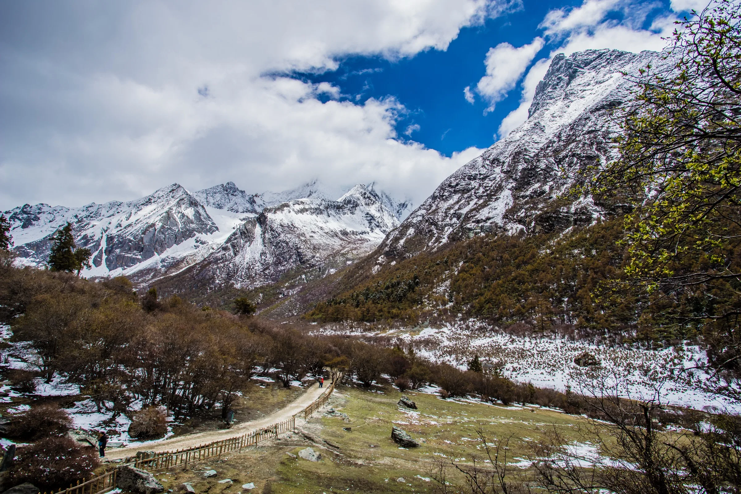 Luorong Pasture surrounded by snow peaks in Daocheng Yading